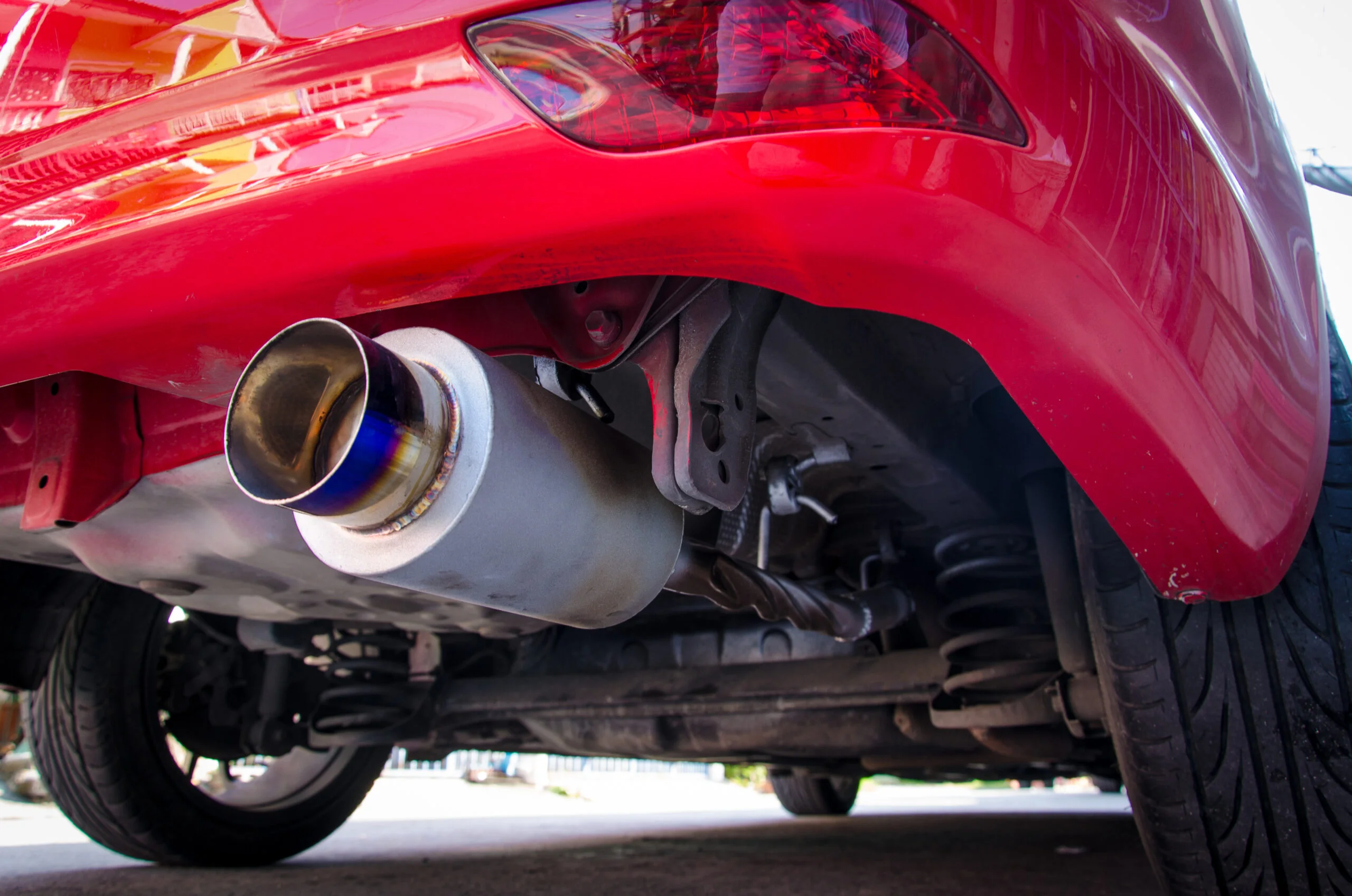 exhaust pipe of red car