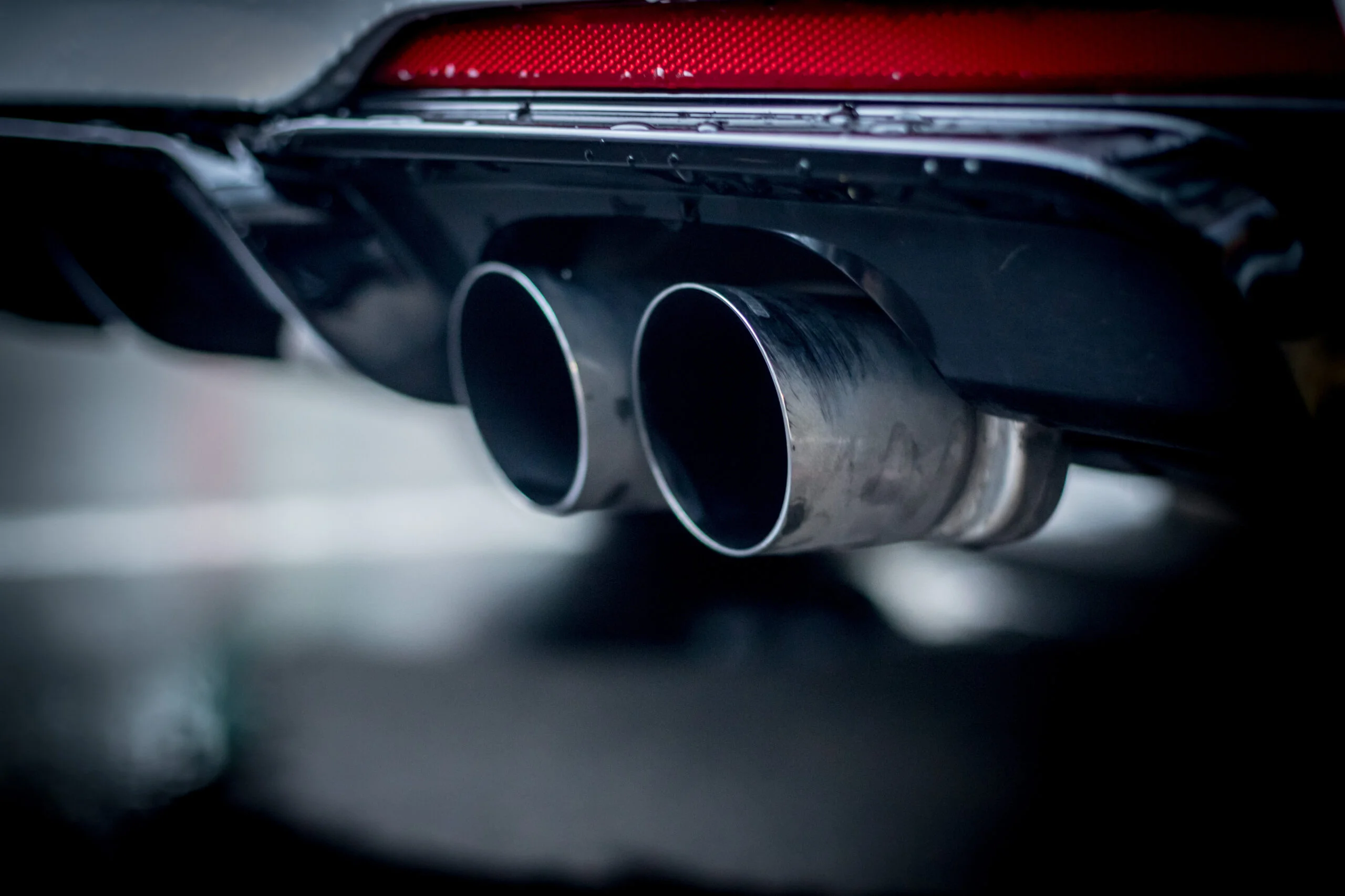 Powerful car with exhaust pipe, pollution and fine dust